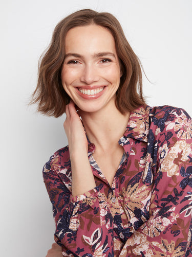 Charming long sleeves enhance the floral blouse, adding sophistication and comfort by Charlie B.