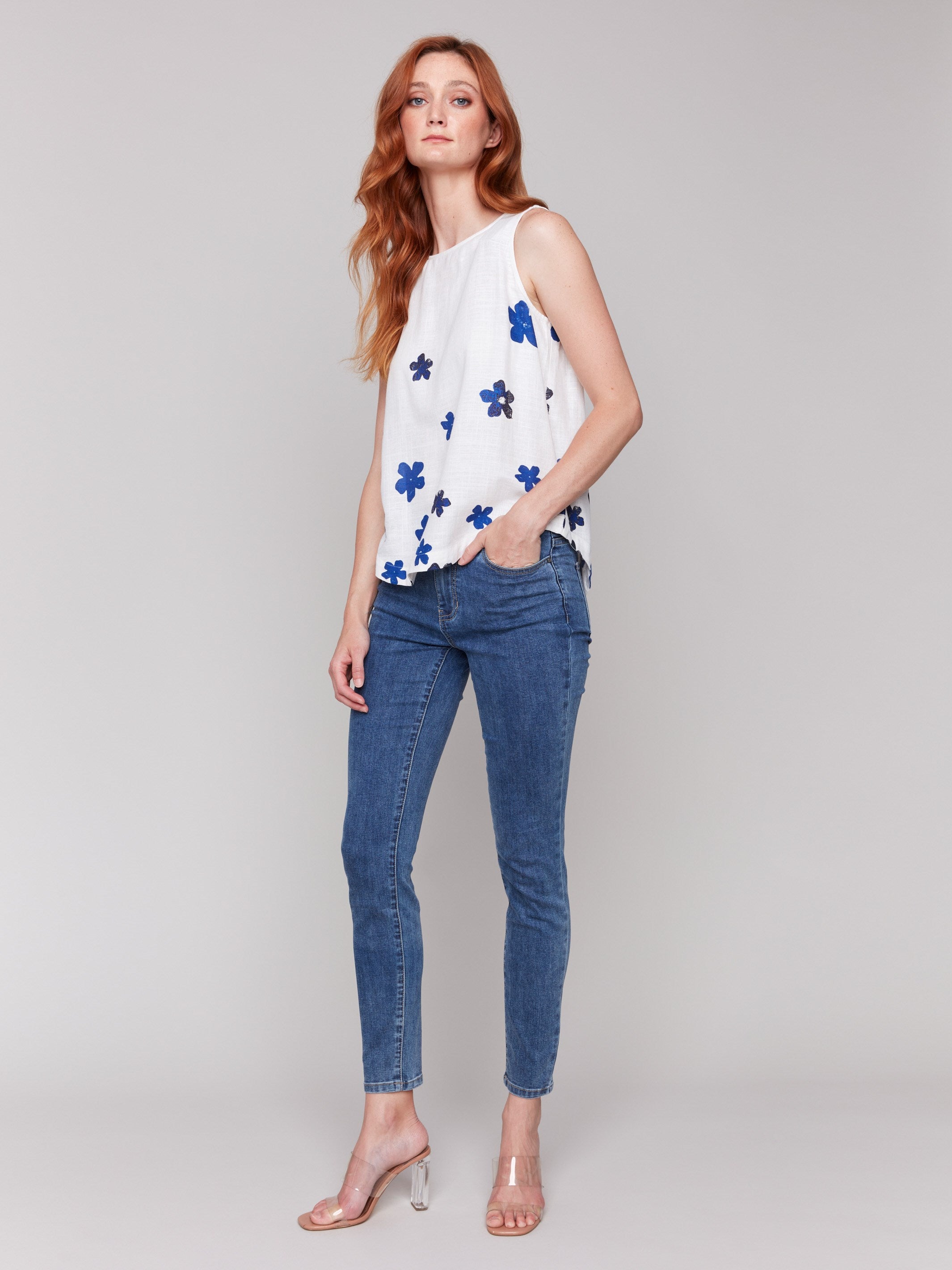 Stylish sleeveless top with intricate floral details by Charlie B.