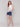 Top with a rounded hem and vibrant floral design by Charlie B.