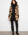 Elegant coat with a tailored collar and striking floral motifs, perfect for any occasion. By Charlie B.