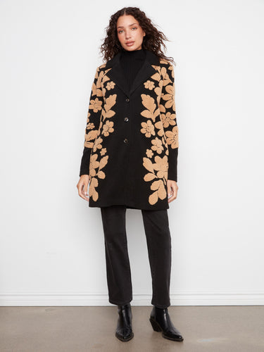 Elegant coat with a tailored collar and striking floral motifs, perfect for any occasion. By Charlie B.