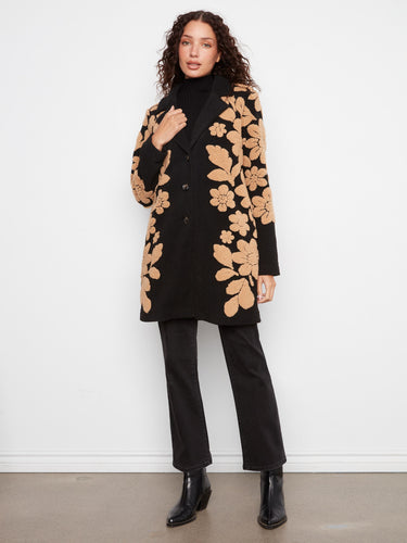 This fashionable coat features exquisite detailing with its tailored collar and button-front style. By Charlie B.