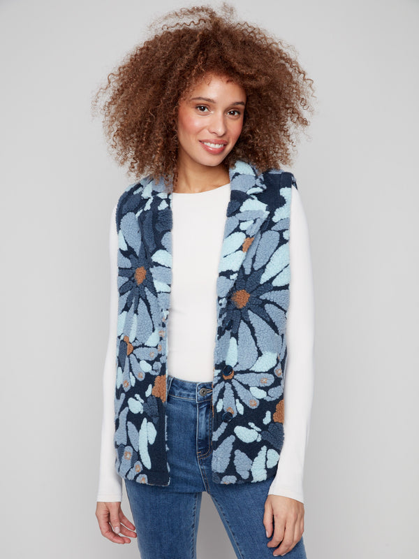 Chic blue floral vest with a stylish spread collar and practical two pockets for added convenience by Charlie B.