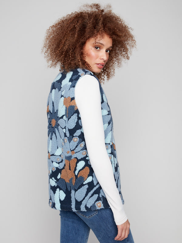Stylish blue floral vest crafted from soft Sherpa fleece, complete with a secure three-button closure by Charlie B.