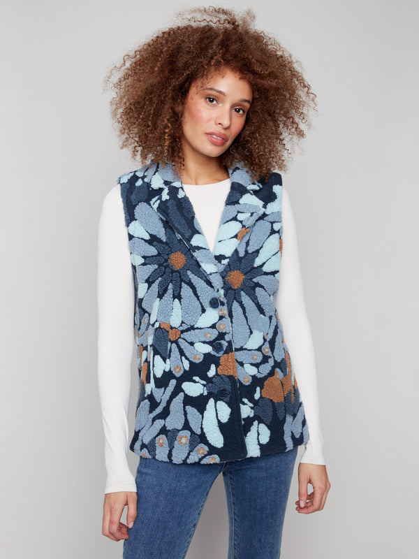 Elegant blue floral vest showcasing a chic spread collar, ideal for adding flair to any outfit by Charlie B.