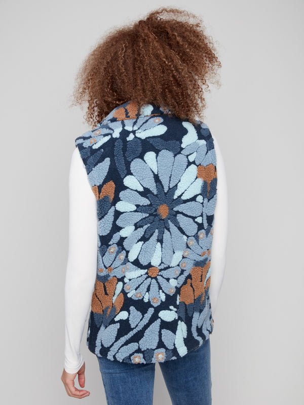 Blue floral patterned vest made from plush Sherpa fleece, designed with convenient two pockets by Charlie B.