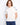 White cotton knit top featuring intricate floral embroidery on the sleeves and a classic crew neckline by Charlie B.