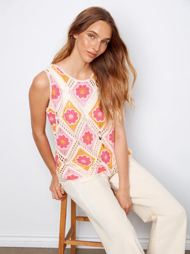 Embrace summer style with this floral pattern top featuring a crew neckline. A delightful choice for any casual outing by Charlie B.
