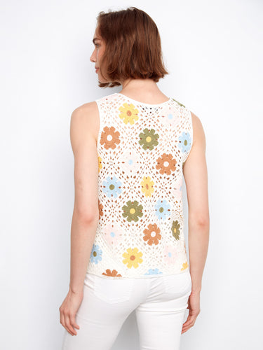 This charming piece showcases a crew neckline and intricate floral designs for a refreshing look by Charlie B.