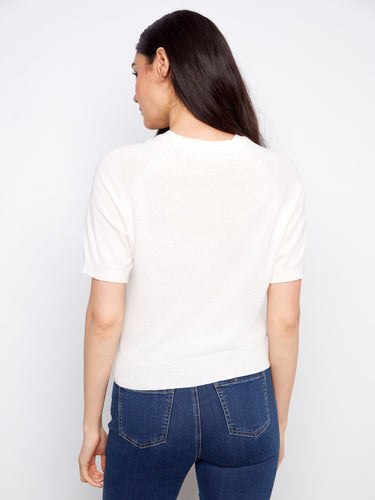 Cotton knit top with raglan sleeves and exquisite floral detailing, offering both comfort and style by Charlie B.