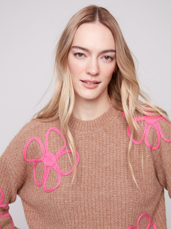 This versatile drop shoulder design in Heather Truffle features delightful pink floral accents for added flair by Charlie B.