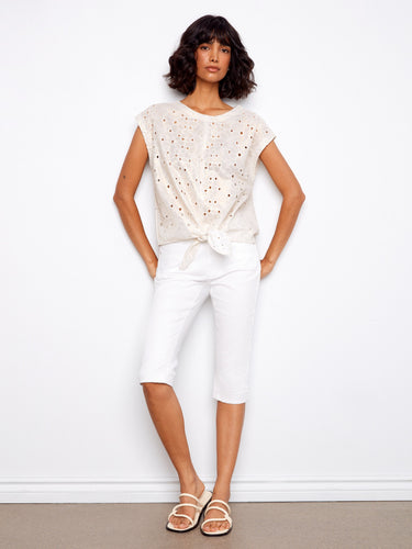 Embrace elegance with this 100% cotton blouse, showcasing intricate foil print and cap sleeves by Charlie B.