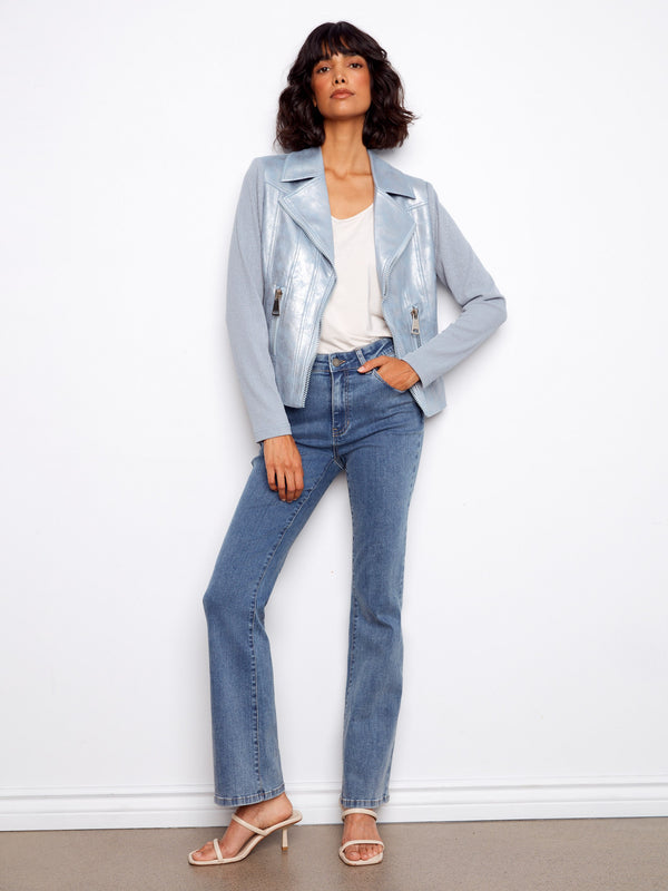 This jacket has a chic hook-and-eye closure, adding elegance to the light blue faux leather design by Charlie B.