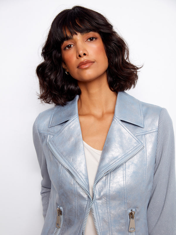 The light blue faux leather jacket showcases intricate zipper details for a modern touch by Charlie B.