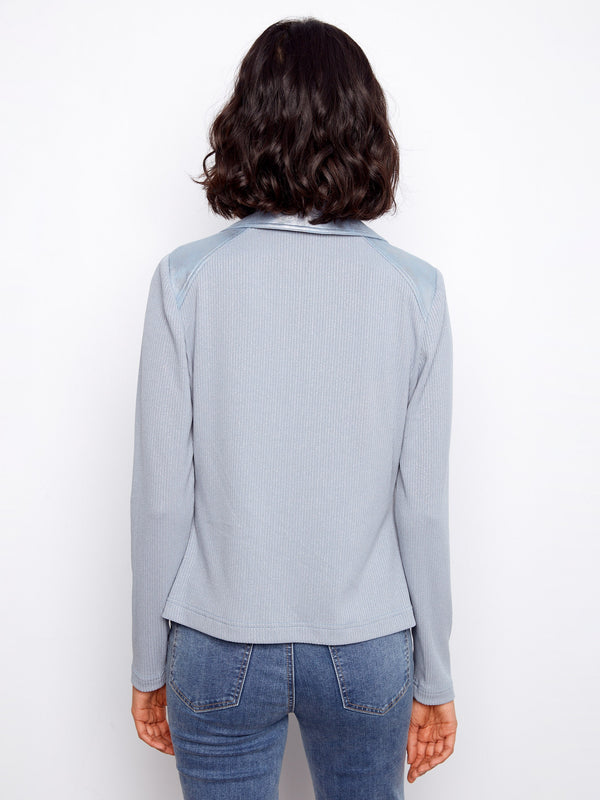 Crafted from foiled faux leather, this light blue jacket offers a trendy and shiny finish by Charlie B.