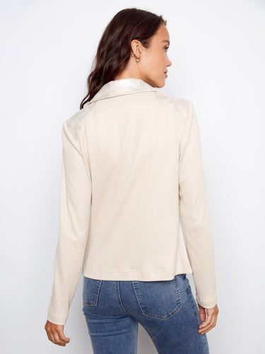 Rib knit sleeves and back provide a comfortable fit to this fashionable jacket by Charlie B.