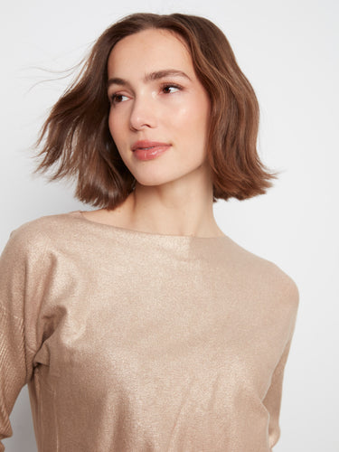 This stylish sweater includes front pockets, combining practicality with a sleek metallic finish for a modern look. By Charlie B.