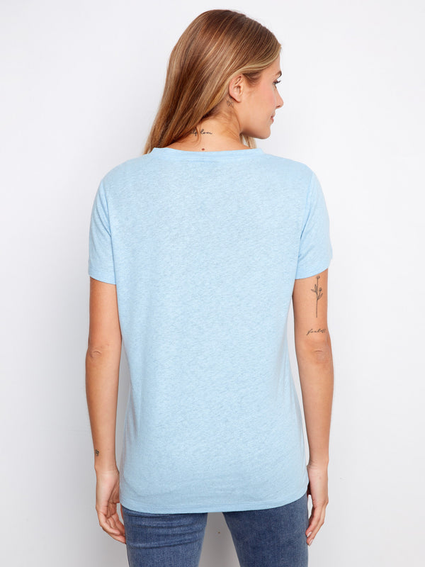 A stylish light blue T-shirt showcasing short sleeves and a comfortable fit, ideal for warm weather days and easy layering by Charlie B.