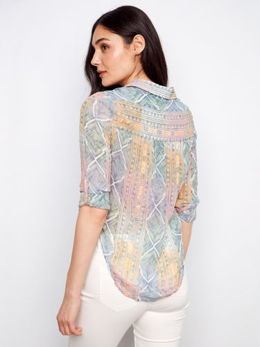 Crafted from semi-sheer crinkle fabric, this shirt offers both texture and style, making it ideal for layering or standalone wear. By Charlie B.