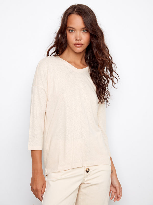 Elegant V-neck top with a relaxed fit, perfect for casual outings. By Charlie B.
