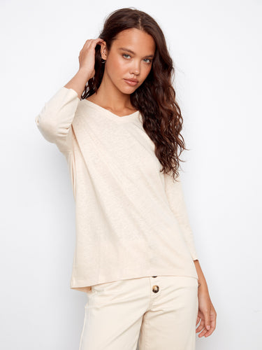 Chic and comfortable 3/4 sleeves enhance the versatile style of this top. By Charlie B.