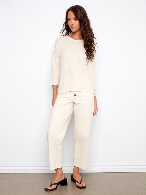 This relaxed fit top offers effortless elegance for any occasion. By Charlie B.