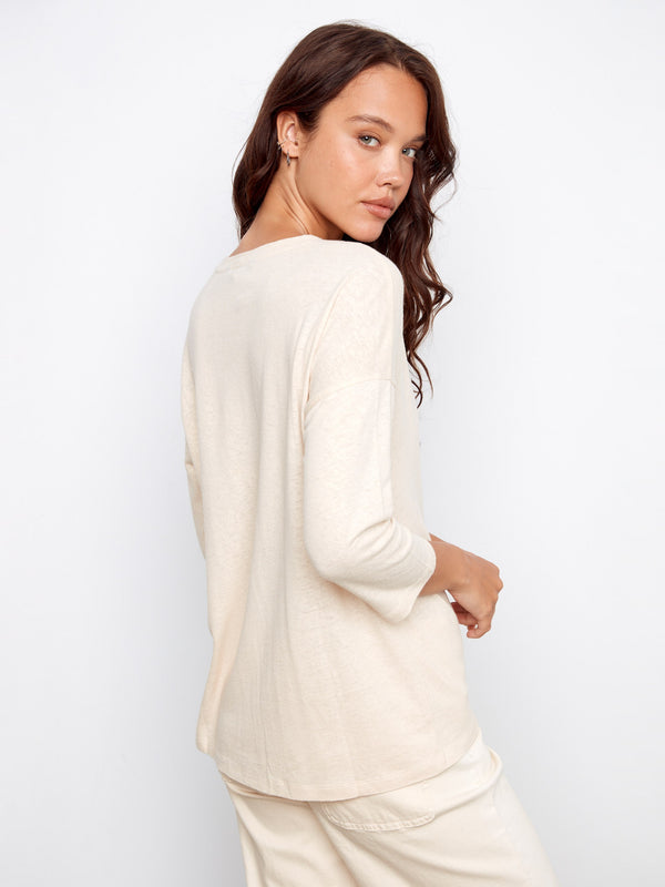The V-neck design complements the laid-back style of this soft, cozy top. By Charlie B.