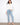 White jean jacket with button front and frayed details, offering a stylish twist to classic denim by Charlie B.