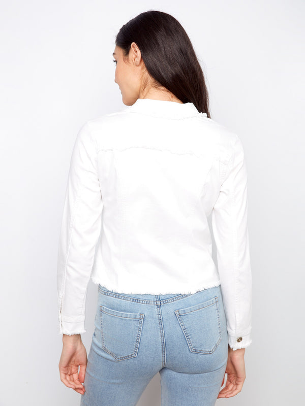 White jean jacket adorned with stylish frayed edges and convenient two front patch pockets, effortlessly cool look by Charlie B.