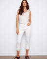 White cropped pants with a regular rise waist and frayed hem, offering a stylish skinny fit by Charlie B.