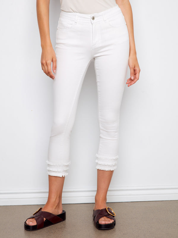 Featuring a five-pocket design and frayed hem, these white cropped pants are crafted for comfort by Charlie B.