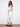 Crafted from stretch twill fabric, these white cropped pants have a chic skinny fit with frayed hems by Charlie B.