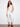 These white cropped pants feature a skinny fit and stylish frayed hem detail for an elegant look by Charlie B.