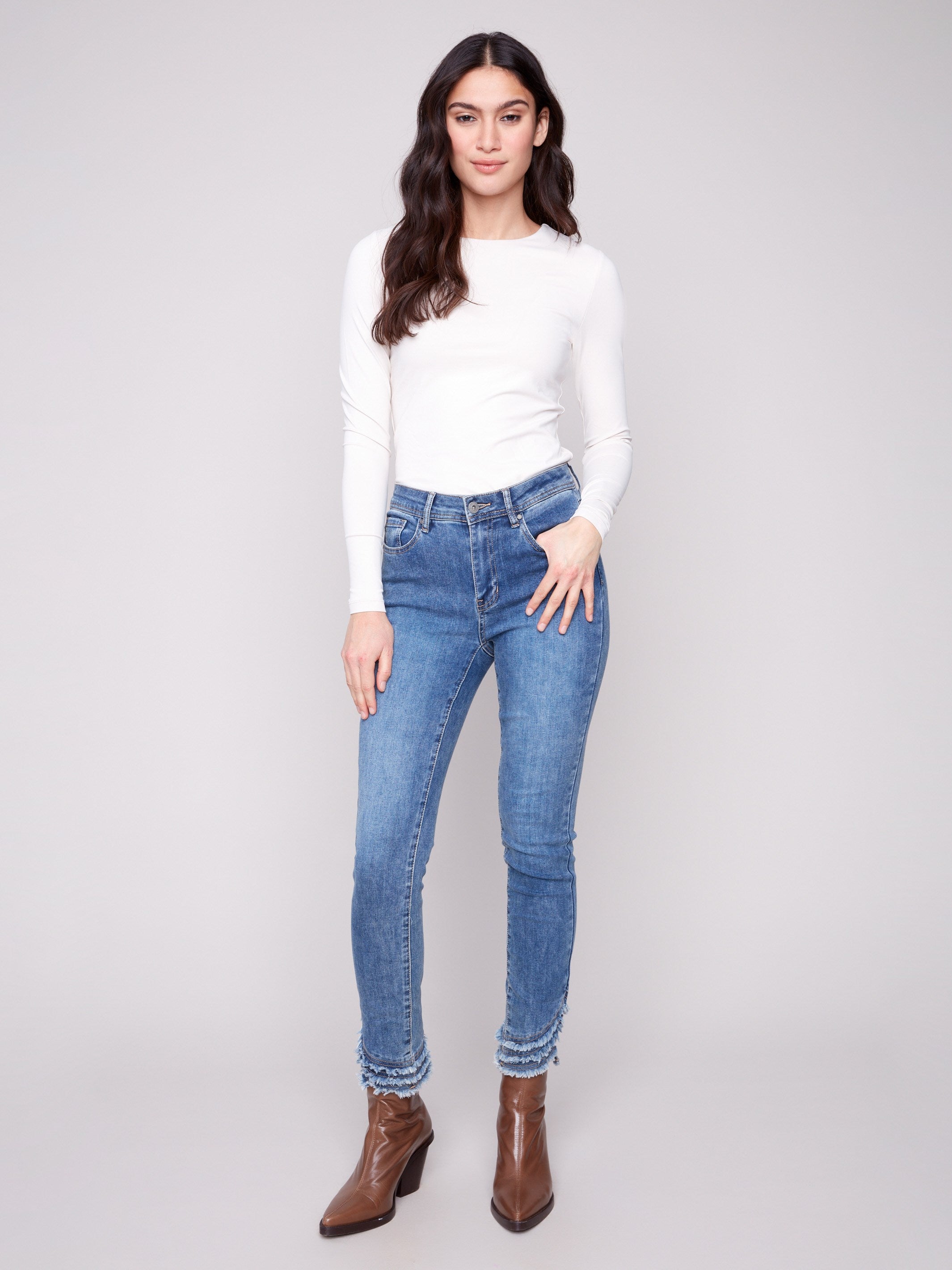 Denim pants in medium blue with a slim fit, highlighted by a five-pocket design for practical style by Charlie B.