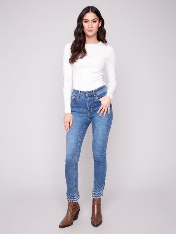 Denim pants in medium blue with a slim fit, highlighted by a five-pocket design for practical style by Charlie B.