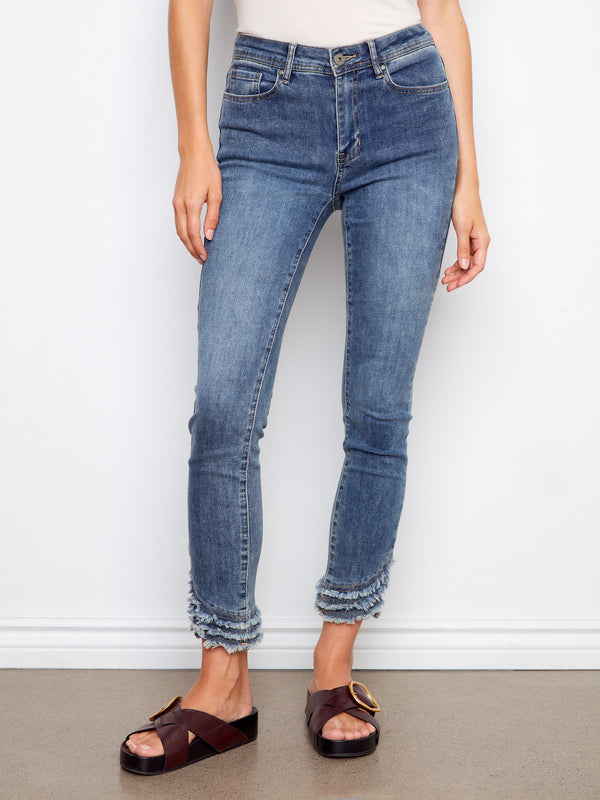 These medium blue denim pants offer a comfortable stretch fabric and chic design by Charlie B.