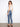 Medium blue jeans with five-pocket styling and trendy frayed hem detail for added flair by Charlie B.