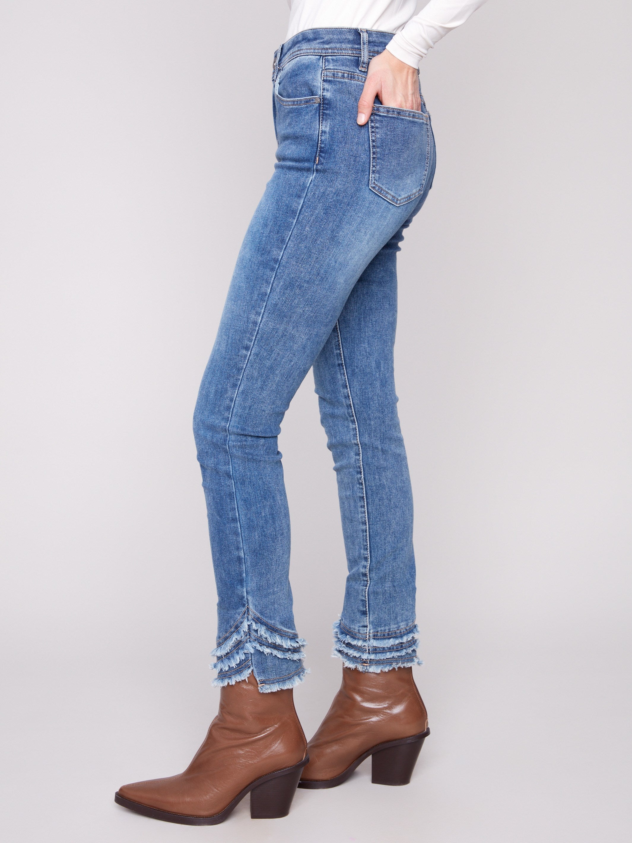 Crafted from stretch denim fabric, these pants provide ease of movement while maintaining their shape by Charlie B.