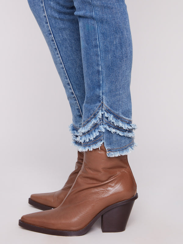 The frayed hem detail adds a unique touch to the classic skinny leg design of these jeans by Charlie B.