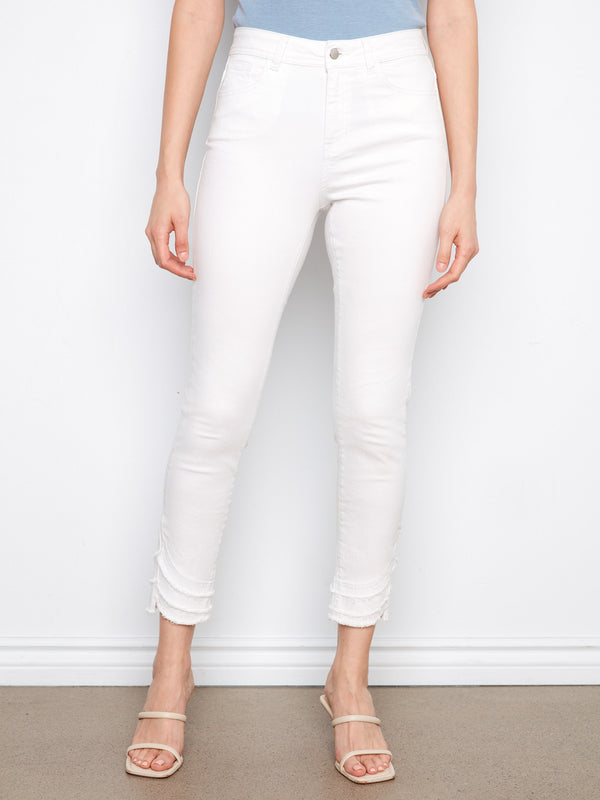 Highlighted by frayed hem detail, these pants add an edgy touch to your wardrobe essentials. Designed by Charlie B.