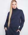 Navy sweater featuring a drop shoulder design, offering a relaxed and comfortable fit. Perfect for casual outings. By Charlie B.