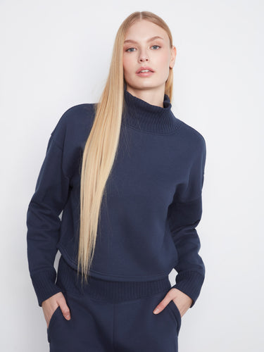 The ribbed hem adds texture to this stylish navy sweater, elevating your everyday fashion effortlessly. By Charlie B.