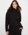 French terry top in black featuring a ribbed mock neck and cotton blend fabric by Charlie B.