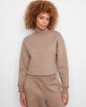 Stylish top featuring a drop shoulder design, perfect for casual wear. Made from a cotton blend for comfort. By Charlie B.