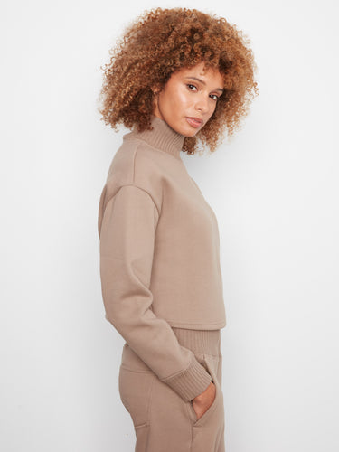 Enjoy the perfect mix of fashion and function with this ribbed mock neck design, tailored for modern tastes by Charlie B.