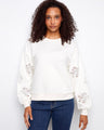 Sweater featuring a crew neckline with intricate sleeve embroidery, offering a stylish touch to your casual look by Charlie B.