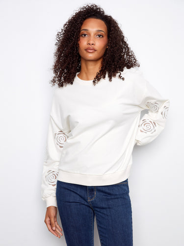 Elegant inserted sleeve embroidery adds a unique flair to this stretch cotton sweater, perfect for any occasion by Charlie B.