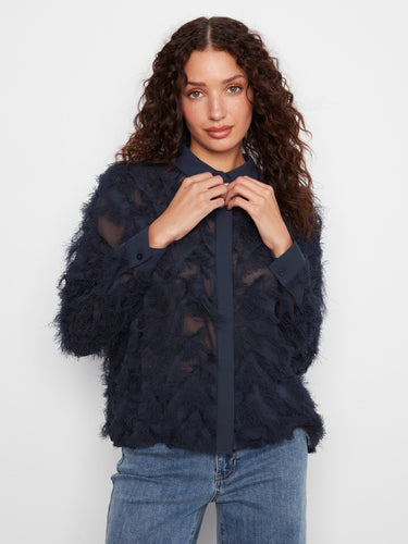 This stylish navy blouse showcases a button-front design, adding versatility to your wardrobe. A must-have piece for chic layering by Charlie B.