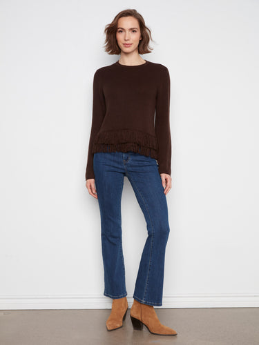 Stylish brown pullover boasting a timeless crew neck paired with an eye-catching fringed hem to elevate your look effortlessly. By Charlie B.