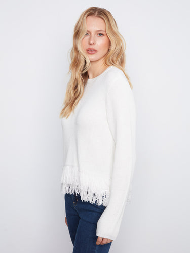 Elegant white sweater with long sleeves, perfect for layering in cooler weather. Crafted by Charlie B.